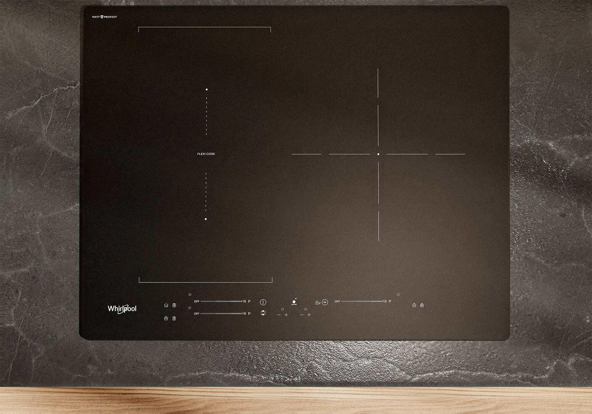 Cooktop com acabamento fosco escuro instalado em bancada de cozinha